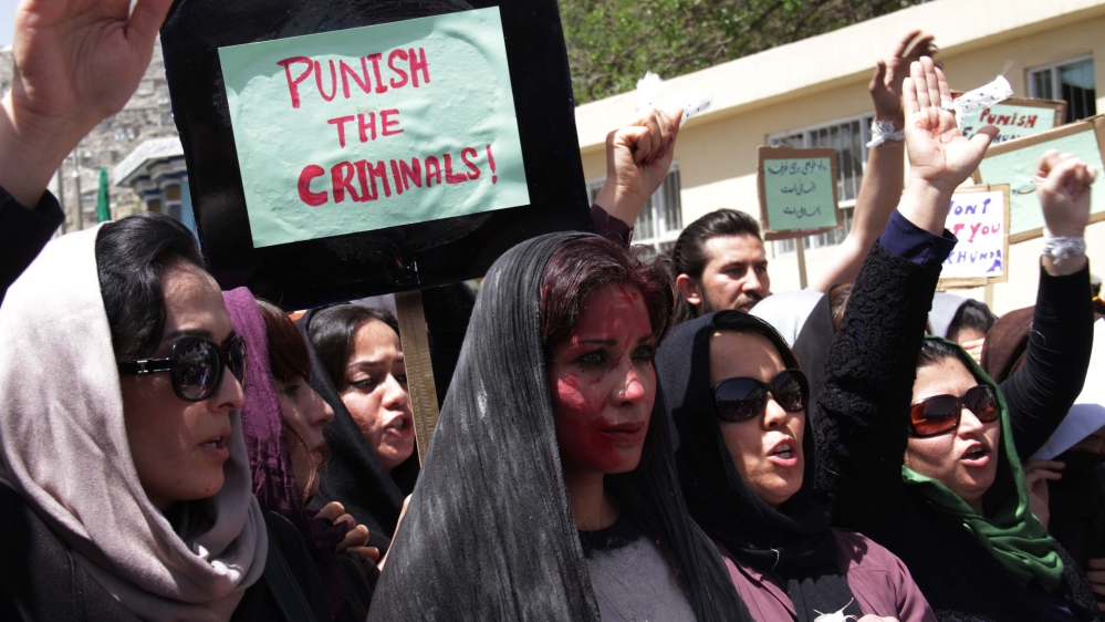 Afghan women chant slogans during a protest demanding justice for a woman who was beaten to death by a mob [Getty]