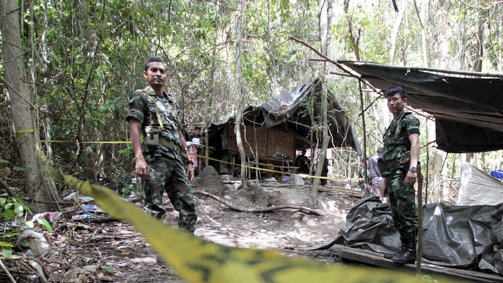 Security forces are seen at an abandoned camp in a jungle in Thailand''s southern Songkhla province