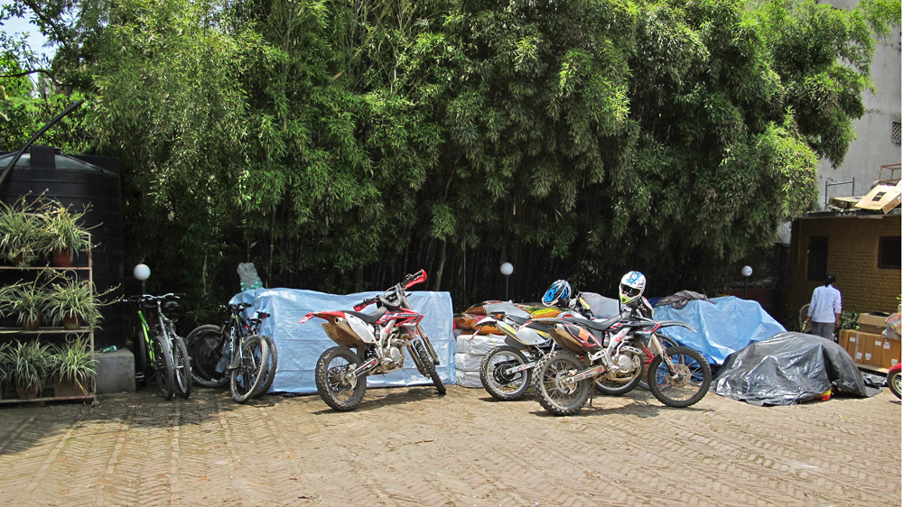 When volunteers head to landslide-affected rural districts, bikers go ahead to scout road conditions [Annette Ekin/Al Jazeera]