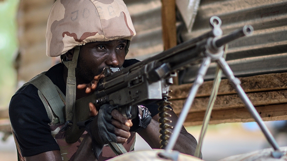 A Nigerian soldier stands guard