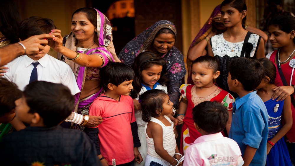 Actress Spandan Chaturvedi, in the centre with the blue collar, is surrounded by fans who travelled for almost two hours to meet her on the set of her TV show [Karen Dias]