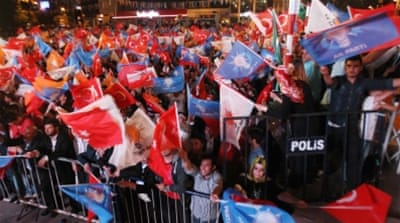 AK party supporters wave flags [Getty]