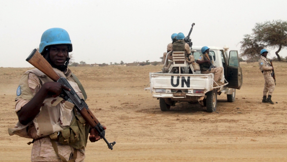UN peacekeepers stand guard in the northern town of Kouroume