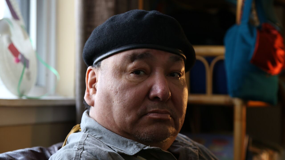 John Fox mourns his daughter, Cheyenne, a native Canadian woman who turned to prostitution and was found dead in 2013 [Karim Shah / Al Jazeera]