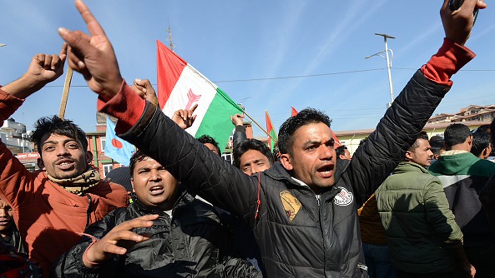Supporters of the 30-party alliance led by the Maoists shout slogans during the general strike in Kathmandu in January [AFP]
