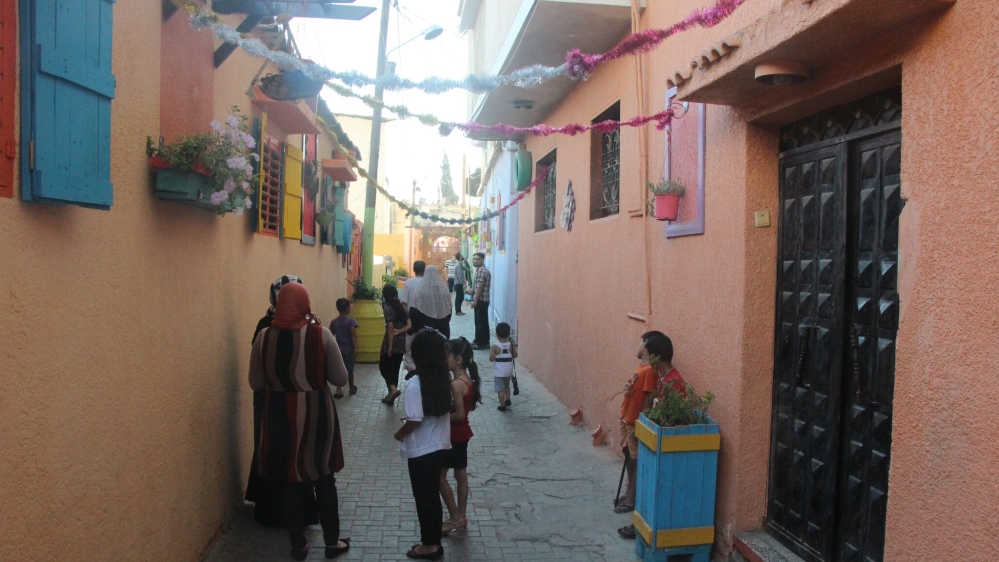 A colourful neighbourhood is a salve for the psychological trauma the war spread through the Strip [Walaa Ghussein/Al Jazeera]
