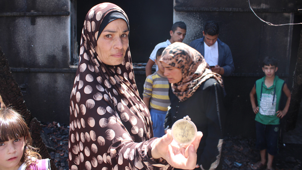 Umm Mustafa, a neighbour of the Dawabsheh family, also had her house targeted by Israeli settlers in the arson attack [Nigel Wilson/Al Jazeera]