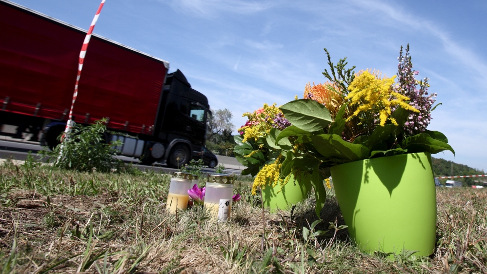 Flowers and candles were placed at the site where the truck was found by an Austrian motorway patrol [Reuters]