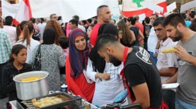 Crowds at the market browsed stalls selling irons, books, clothes, Polaroid photographs, snacks, movie posters and more [Martin Armstrong/Al Jazeera]