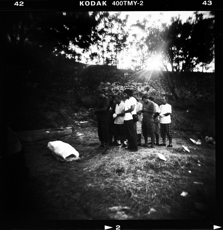Refugees pray during a funeral ceremony for an unnamed Syrian refugee in Mytilene's cemetery - Lesvos, Greece, August 2015 [Giorgos Moutafis]