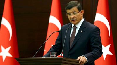 Handout photo of Turkish Prime Minister Davutoglu speaking during a press conference in Ankara