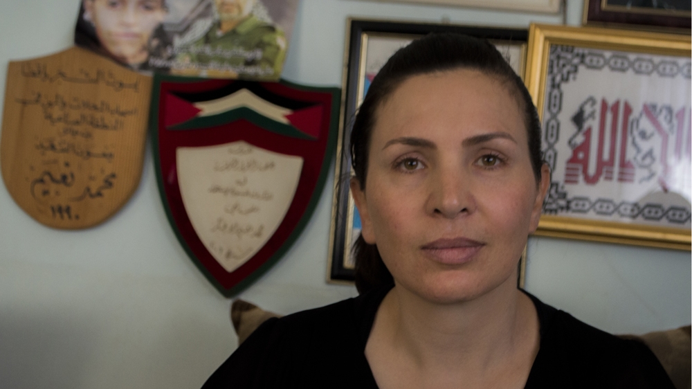 Manal Abu Akhar took part in the second Intifada, and now has her own teenage daughter to worry about during this most recent uprising [Abed al Qaisi/ Al Jazeera]