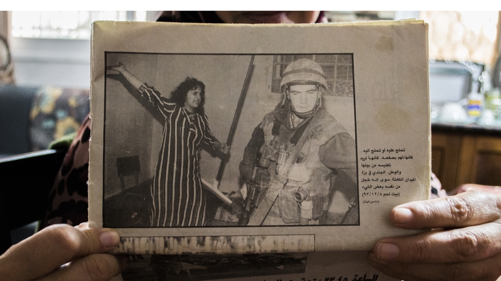 'You can't see it in the photo, but there was already a soldier on the ground that I had hit,' Raja Mustafa explains [Abed al Qaisi/Al Jazeera]