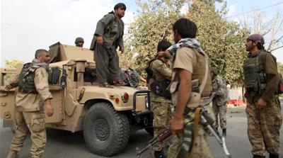 Afghan security forces prepare to transport an injured civilian after a battle with the Taliban in the city of Kunduz [Reuters]