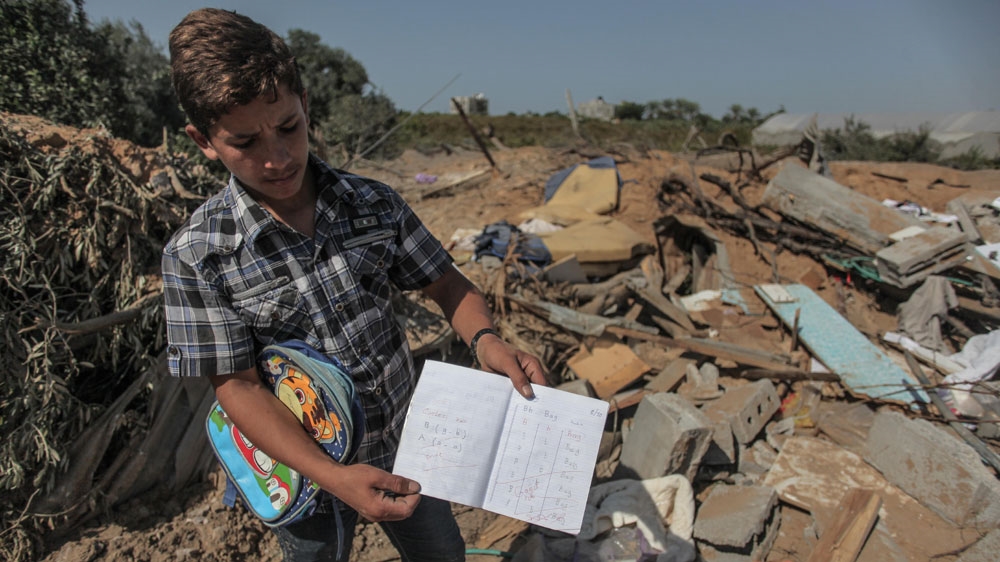 Israel's air strikes have killed people and seen homes crushed to rubble but it says its planes target Hamas weapons-manufacturing sites [Ezz Zanoun/Al Jazeera]