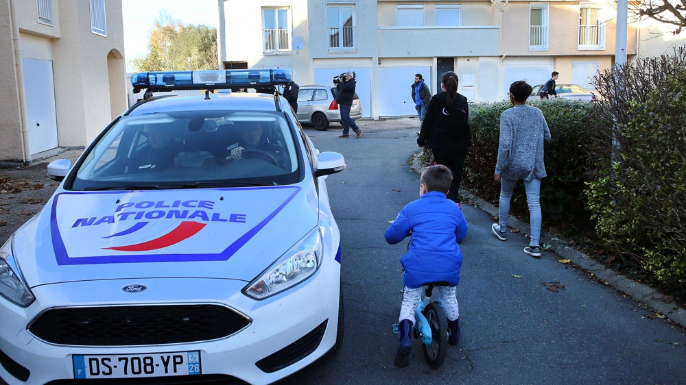 A police car patrols in front of the former home of Ismail Omar Mostefai, who is alleged to have been one of the gunmen in the attack at the Bataclan concert hall [Maya Vidon-White/Al Jazeera]