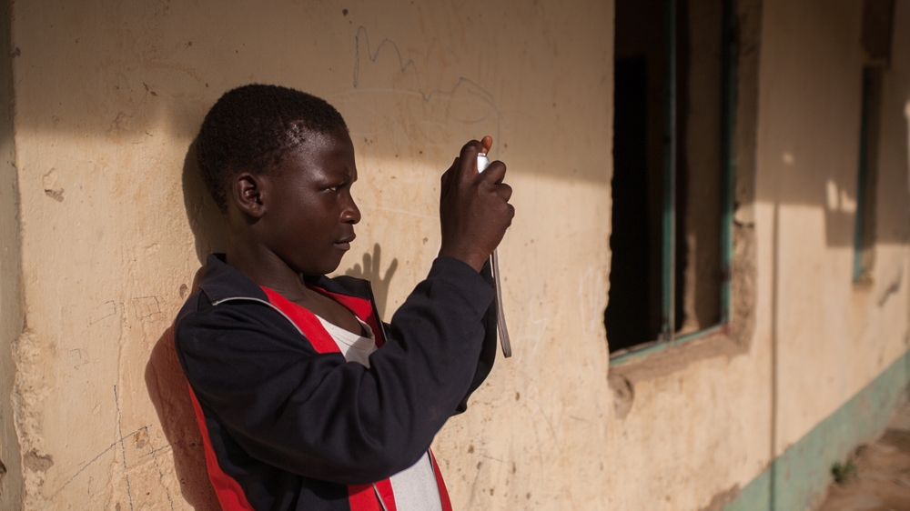 Ali says he is very happy that he had the chance to learn photography [Ruth McDowall/Al Jazeera]