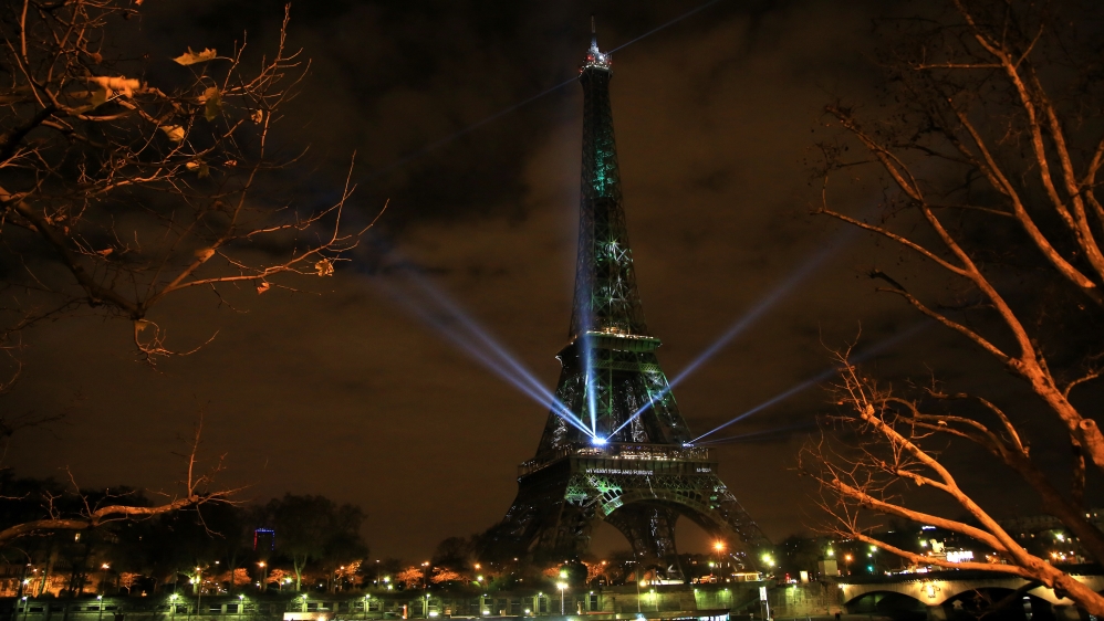 An artwork entitled One Heart One Tree by artist Naziha Mestaoui is displayed on the Eiffel tower [AP Photo/Thibault Camus]