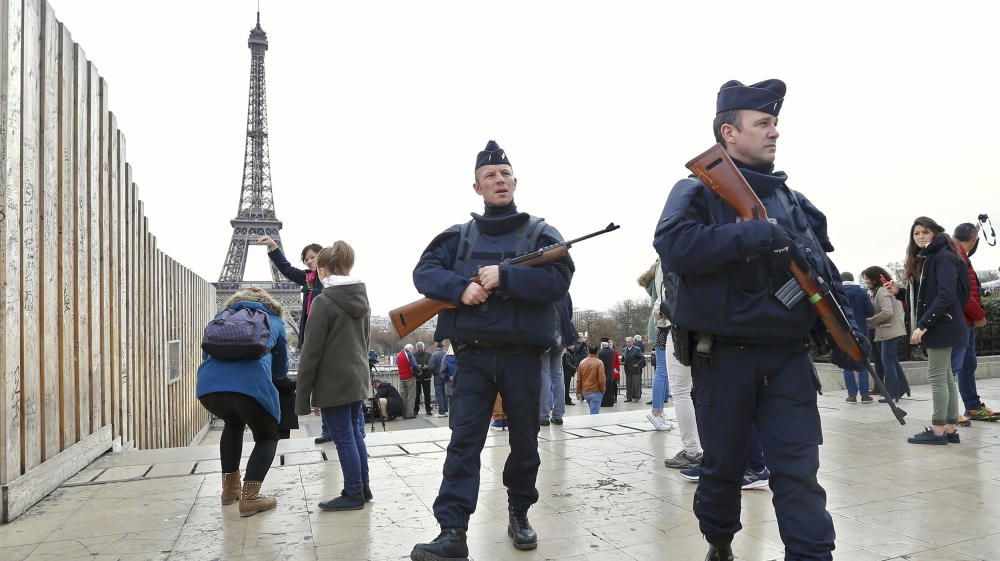 Police patrol near the Eiffel Tower the day after a series of deadly attacks in Paris