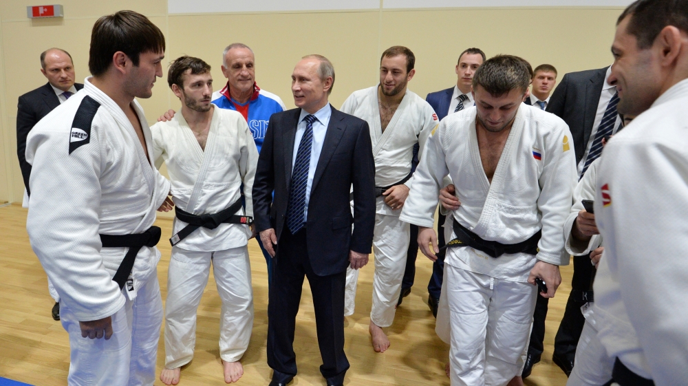 Putin speaks to athletes before his late-night meeting with the heads of Russia''s sports federations in the Black Sea resort of Sochi, Russia [AP]