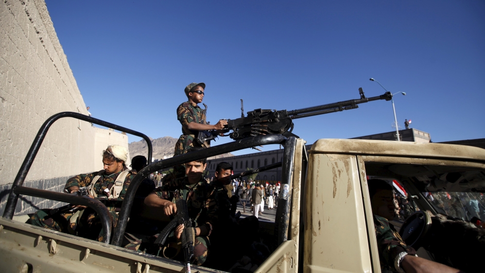 Houthi militants sit on the back of a patrol truck as they secure the site of a rally commemorating the anniversary of South Yemen''s independence from British colonial rule, in Yemen''s capital Sanaa