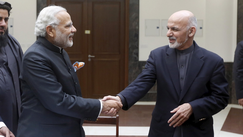 India''s PM Modi shakes hand with Afghanistan''s President Ashraf Ghani during inauguration of Afghanistanâ€™s new parliament building in Kabul