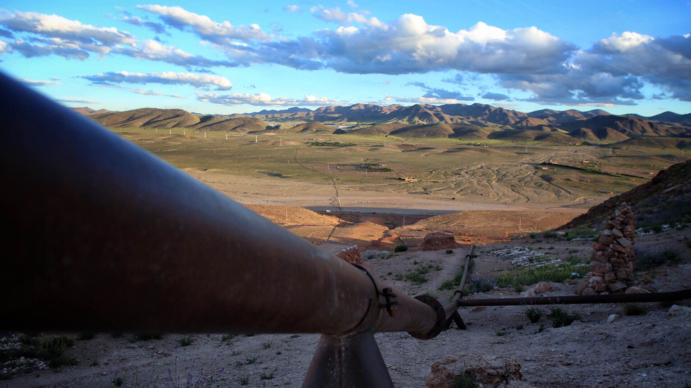 This water pipe to the mine now runs empty after activists closed a valve on top of Mount Alebban [Nadir Bouhmouch/Al Jazeera]