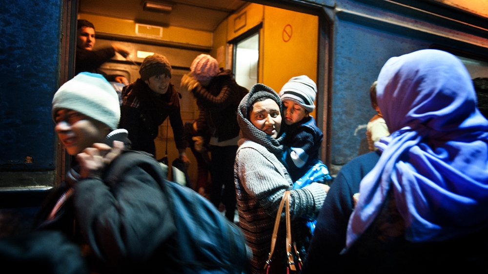 People are disorientated and dazed as they disembark from the train [Mona van den Berg/Al Jazeera]