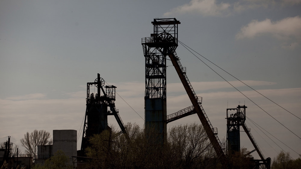 The elevator towers of an old mine in Krasnodon. The mines and the equipment they use date back to the Soviet Union. Soviet technology may not work very well, say people in the Donbass, but it will work forever. [Janos Chiala and Tali Mayer/Al Jazeera]  
