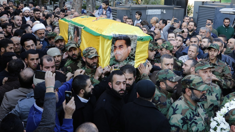 Hezbollah members and relatives carry Kantar's coffin during his funeral in a southern suburb of Beirut on Monday [Nabil Mounzer/EPA]