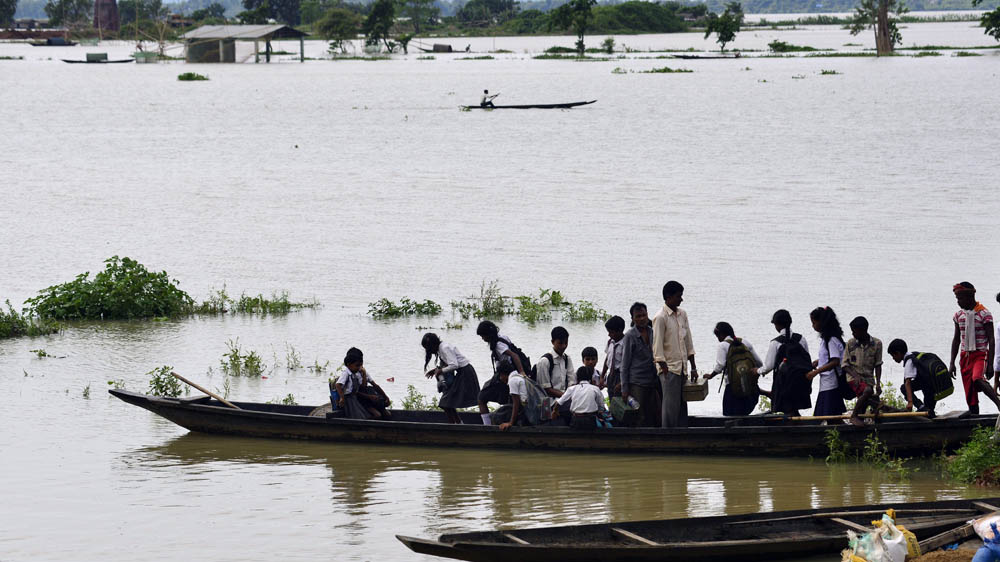 Heavy flooding in Assam state often disrupts schooling, and adds to the problems of its impoverished population [EPA/STR]