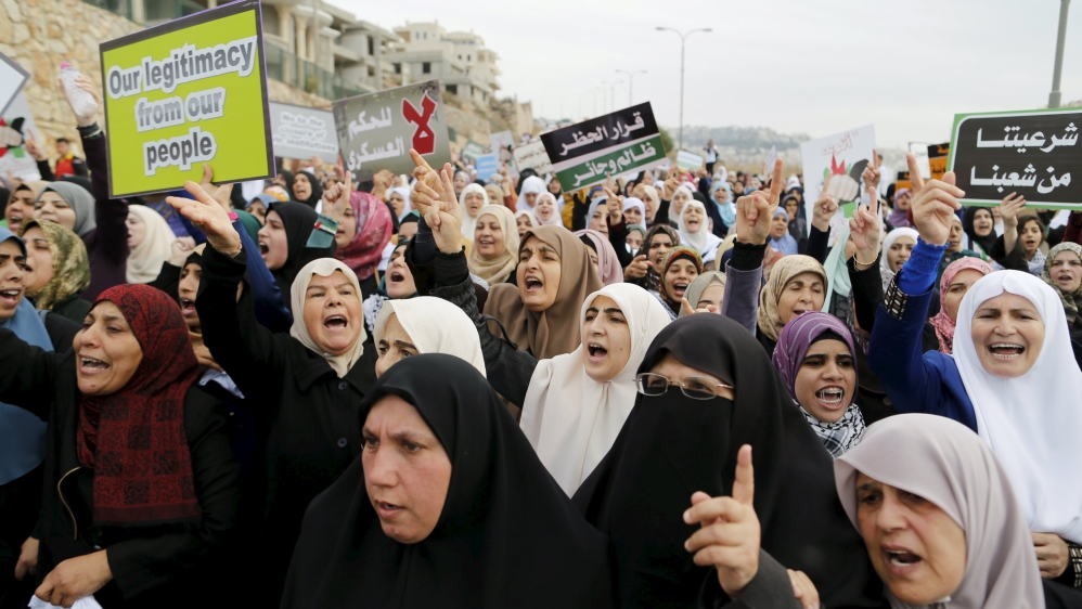 Israeli Arab protesters women shout slogans during a demonstration against the outlawing of the Islamic Movement''s northern branch, in the northern Israeli-Arab town of Umm el-Fahm