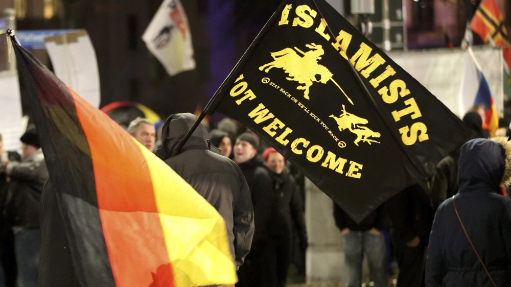 Members of LEGIDA, the Leipzig arm of the anti-Islam movement PEGIDA, take part in a rally in Leipzig