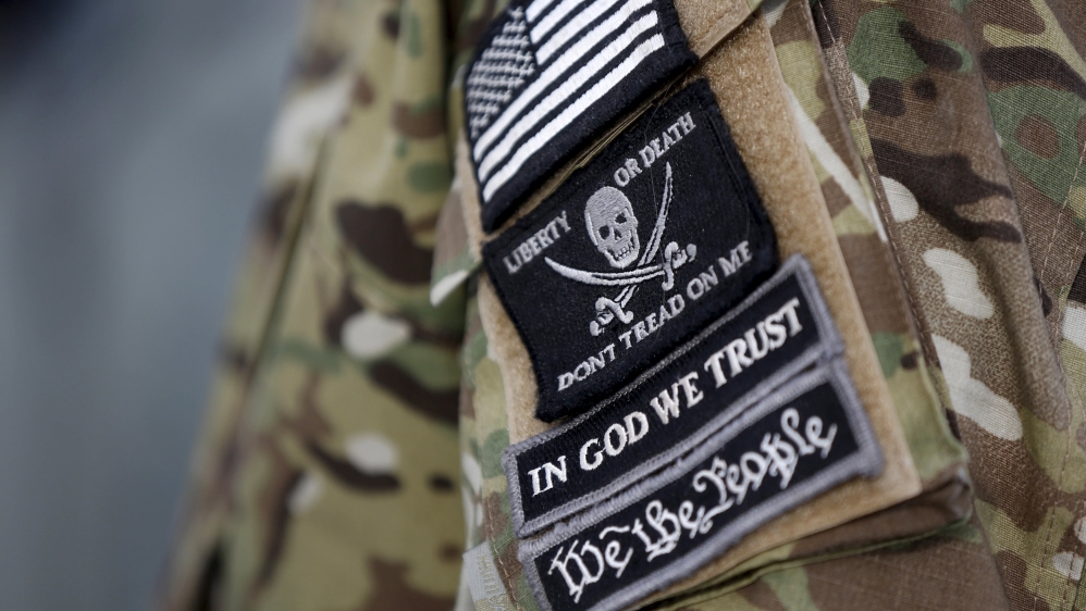 Patches on the sleeve of a militiaman is seen at the Malheur National Wildlife Refuge near Burns, Oregon [REUTERS]