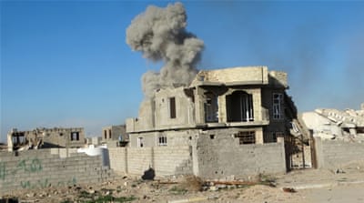 Smoke rises during an air strike in Ramadi city [Reuters]