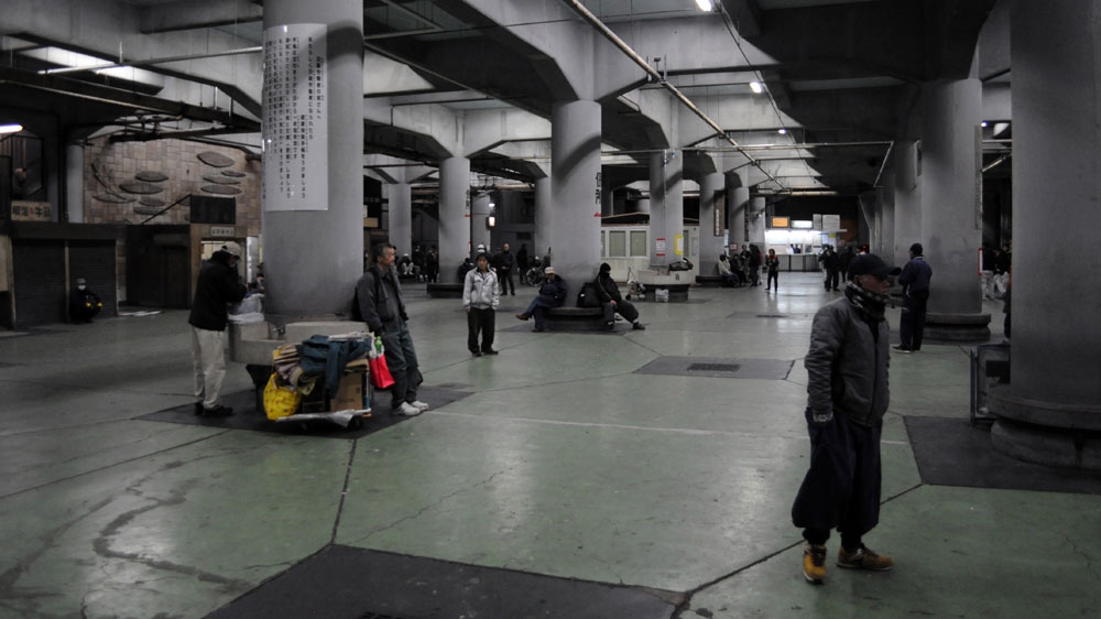 A few dozen people early on a weekday morning last December at the Airin Public Labor Exchange in Osaka's Kamagasaki district [Joe Jackson/Al Jazeera]