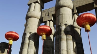 Traditional Chinese lanterns are installed in the Luxor Temple in preparation for a visit by Chinese President Xi Jinping, in Luxor, Egypt [AP]