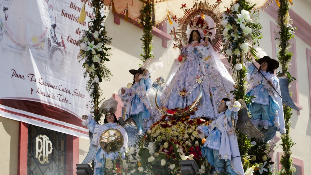New dancers make a vow to the Virgin to dance in the festivity for three straight years [Carlos Tello/Al Jazeera]