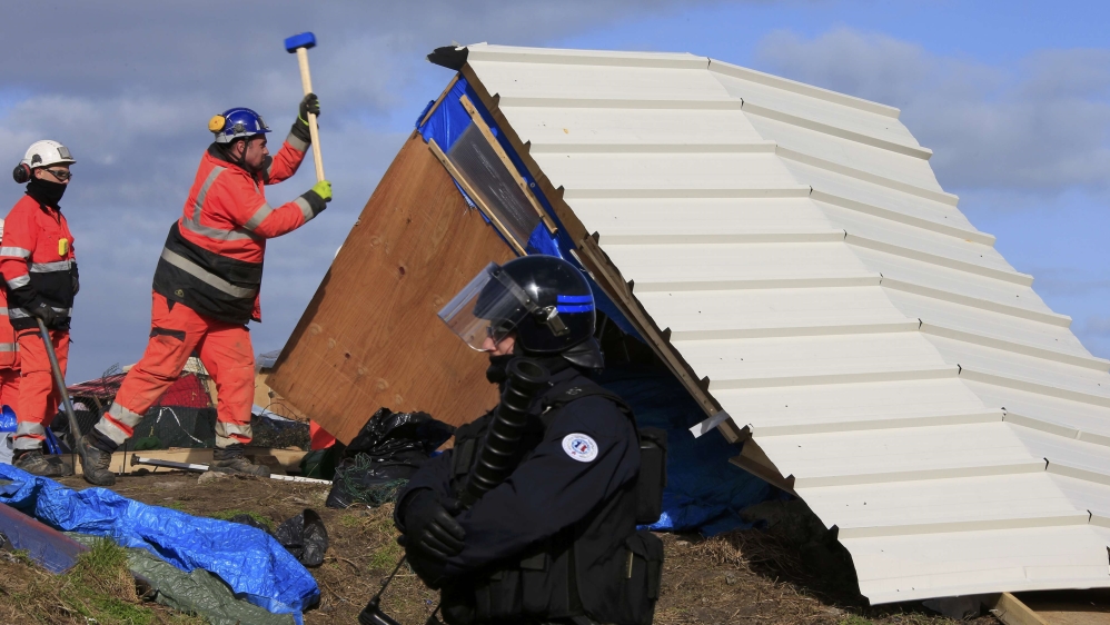 
Known as the Jungle, the Calais camp was used by refugees who wanted to migrate to Britain [Pascal Rossignol/Reuters] 
