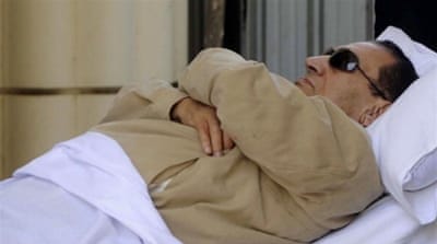 Ousted Egyptian president Hosni Mubarak is wheeled into an ambulance following his verdict hearing in Cairo on June 2, 2012 [AFP]