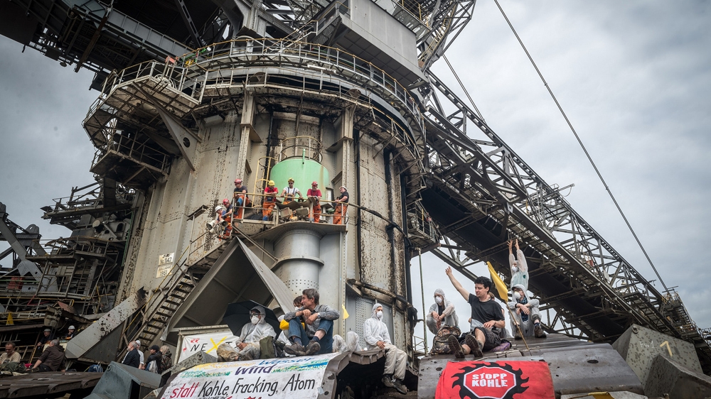 'Songs and chants meet batons and pepper spray while diggers gouge the earth and wind turbines salute the sky' [350.org]
