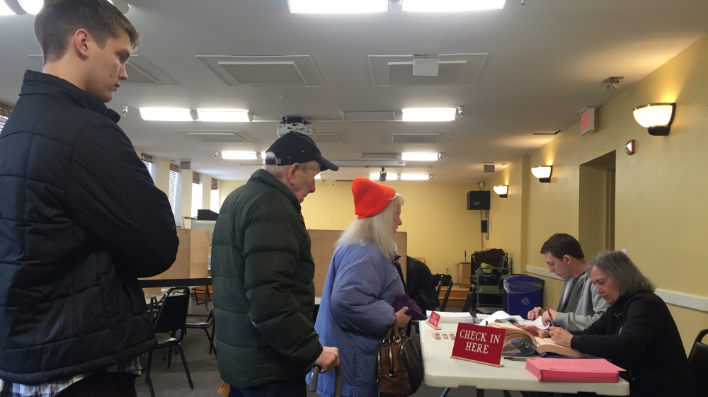 Voters wait in line at a polling station in the Fletcher Free Library in downtown Burlington, Vermont [Anar Virji/Al Jazeera]