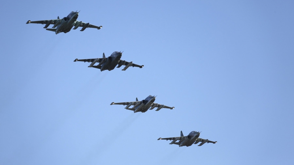 Russian Ministry of Defence handout photo shows Russian Sukhoi Su-25 fighter jets flying in formation after returning from Syria, before landing at an airbase in Krasnodar region, southern Russia