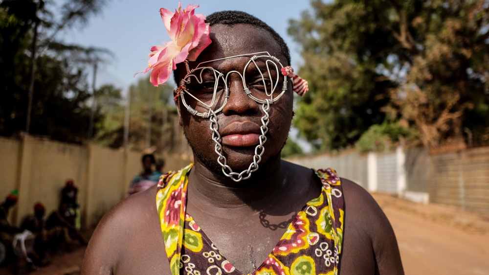 With instruments made from bamboo, plant-based face paints, and skirts woven from local fauna, groups at Guinea Bissau's Carnival dance competition displayed the biodiversity of their country.  Teams of performers competed in ceremonial dances from the country's many ethnic groups in a carnival themed Rescue and Promote Our Culture. The dances represented traditional events such as the harvest and coming-of-age ceremonies. [Ricci Shryock/Al Jazeera]
