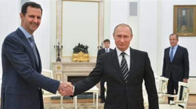 Russian President Vladimir Putin shakes hands with Syrian President Bashar Assad in 2015 [AP]