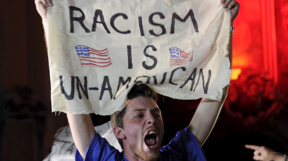 A protester interrupts U.S. Republican presidential candidate Trump''s speech during a campaign rally in Kansas City