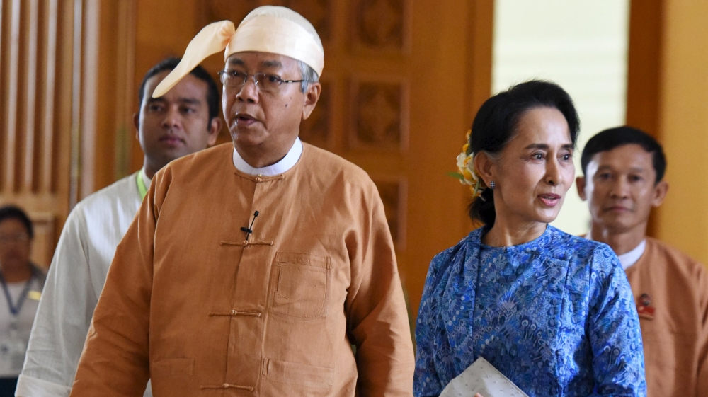 Myanmar''s new president Htin Kyaw (L) and National League for Democracy party leader Aung San Suu Kyi arrives to parliament in Naypyitaw