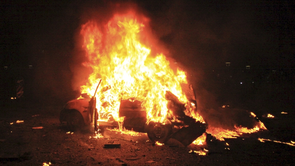 A vehicle burns after an explosion in Ankara