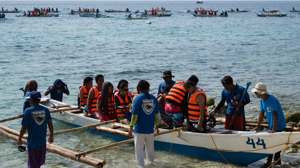 Oslob's tourist numbers have soared since it began its whale shark interaction project in 2011, based on luring sharks close to the shore by feeding them [Angel L Martinez Cantera/Al Jazeera] 