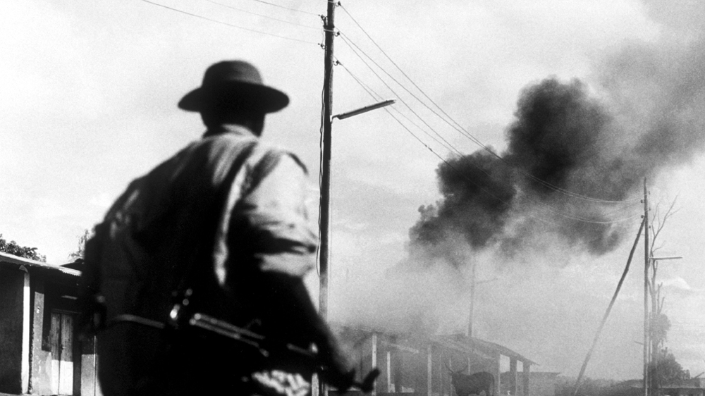 An RPF soldier makes his way north towards Kigali [Jack Picone/Al Jazeera] 